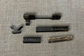 Assorted Rifle Scope Mounts and Rails, assortment laid out