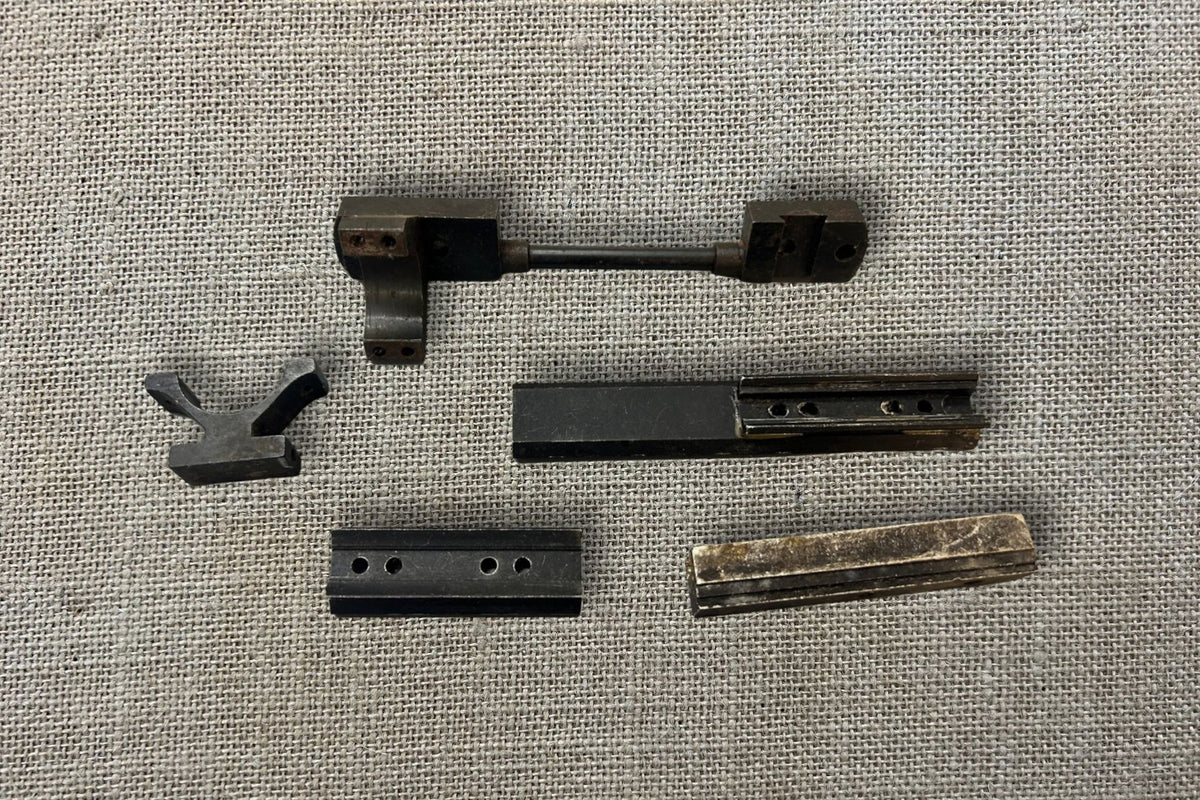 Assorted Rifle Scope Mounts and Rails, assortment laid out