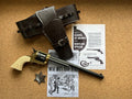 Colt Buntline Special .45 Replica Revolver, 12-inch, with a western holster, a sheriff's star and old newspaper pages