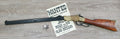 Henry 1860 Lever-Action Rifle Replica, left side, full length with a wanted poster and a badge