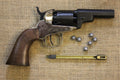 Colt 1849 Pocket Revolver Replica (Wells Fargo Model), side view with lead balls and a loading tool