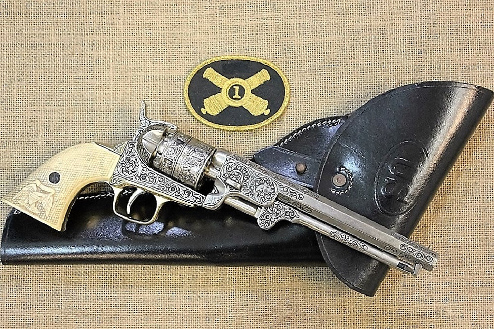 Engraved Colt 1851 Navy Replica Revolver (Ivory-Look Grips), with a black leather holster and an artillery patch