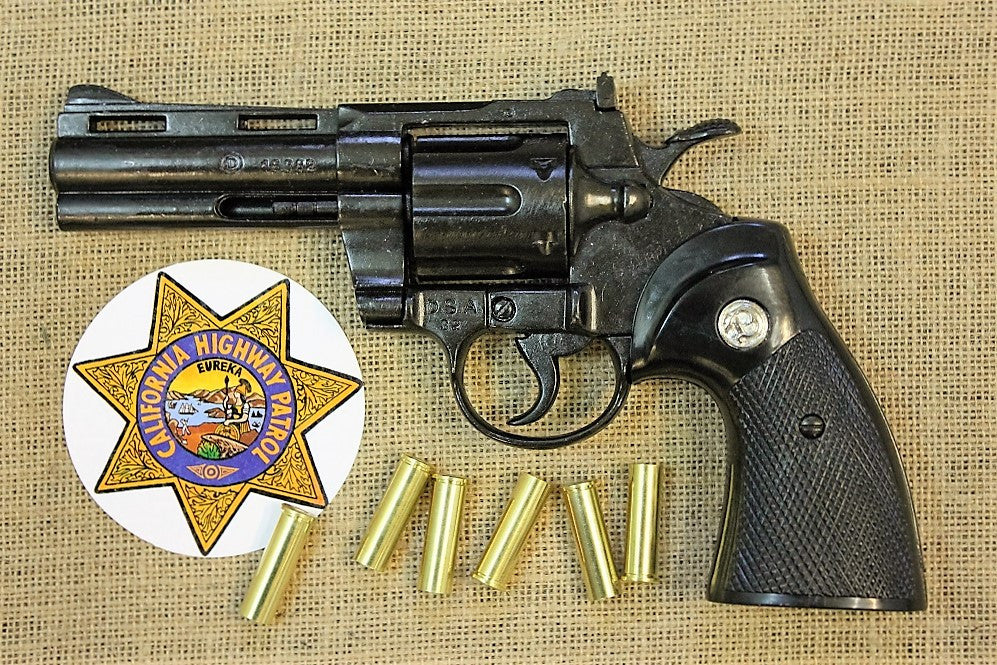 Colt Python .357 4in Replica Revolver, left side with a highway patrol badge and dummy rounds