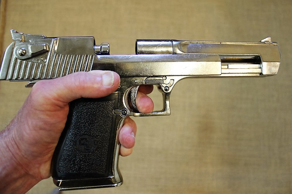 Desert Eagle .357 Replica Pistol (Chrome), in the hand with the slide back