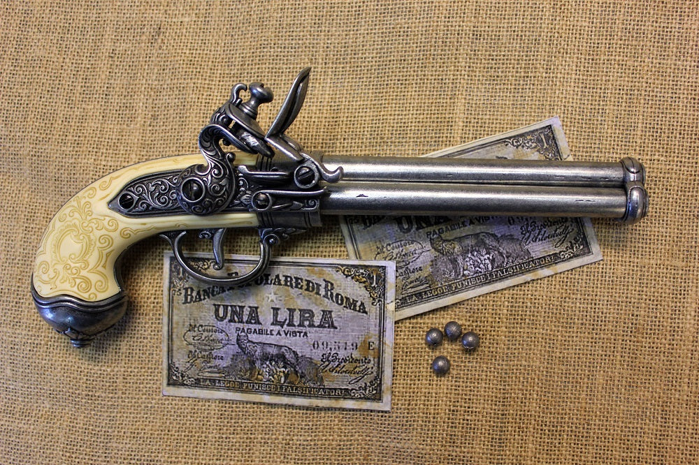 Italian Three-Barrel Flintlock Pistol Replica, 1680, side view with Italian lira banknotes and lead balls