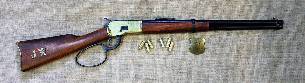 Winchester 1892 Large-Loop Carbine Replica, right side, full length with dummy rounds and a badge