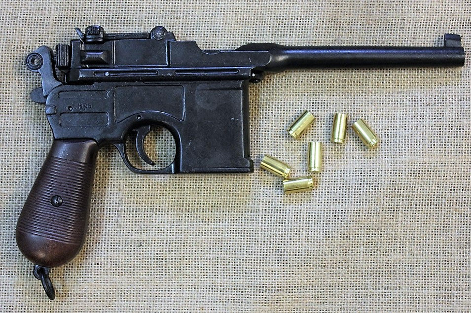 Mauser C96 'Broomhandle' Replica Pistol, side view with brass cases
