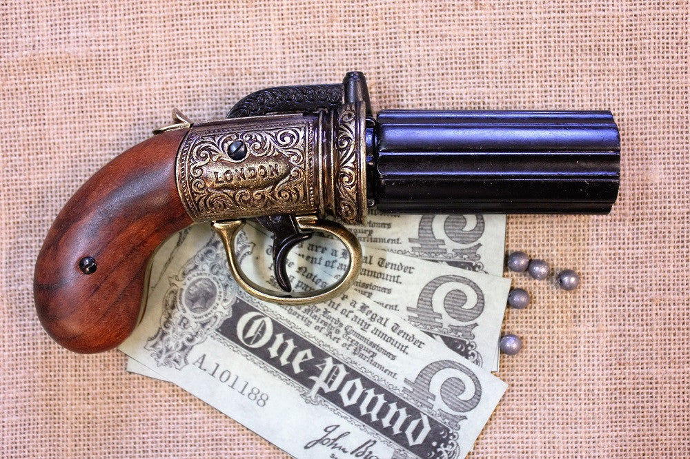 London 1840 Pepperbox Revolver Replica (6 Barrels), side view with a one-pound note and lead balls