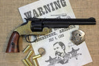 Smith & Wesson Schofield Replica Revolver (Brass Frame), right side with a Tombstone poster, a badge and dummy rounds